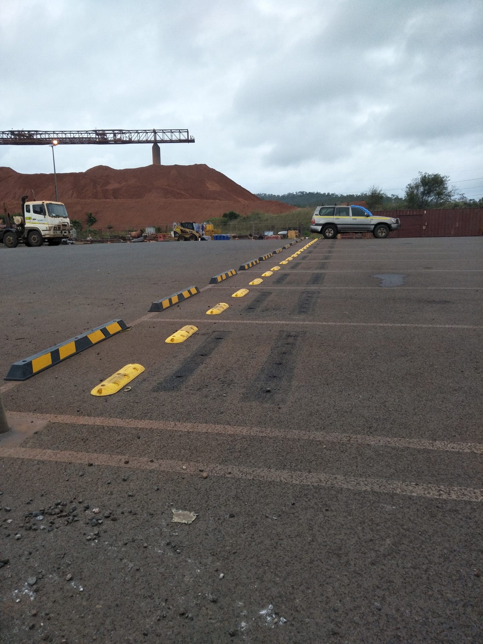 Fundamentally Stable Parking Bay Rumble Bar and Wheel Stops